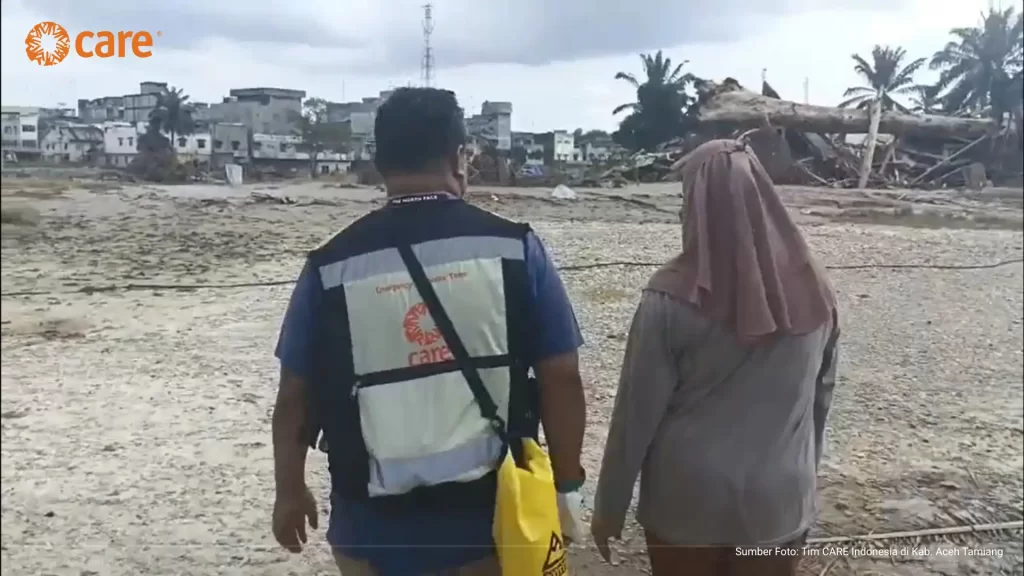 Walking together, the CARE team and Sufika visited the land where her house once stood